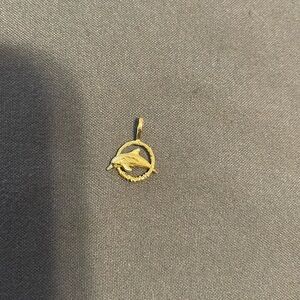 Vintage gold tone dolphin pendant